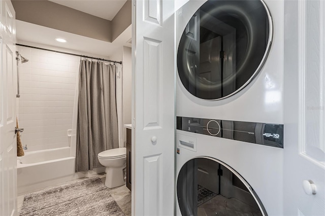 washroom with stacked washing maching and dryer