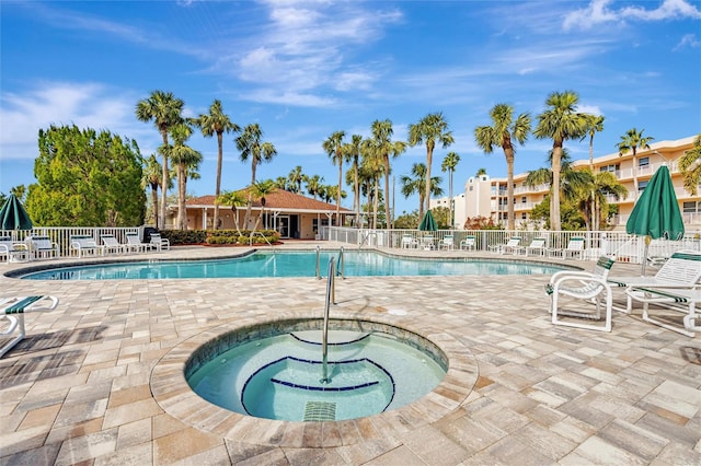 view of pool featuring a patio area and a community hot tub