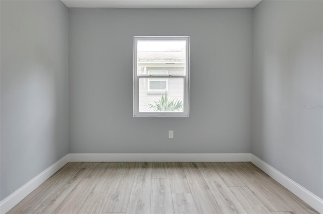 spare room with light wood-type flooring