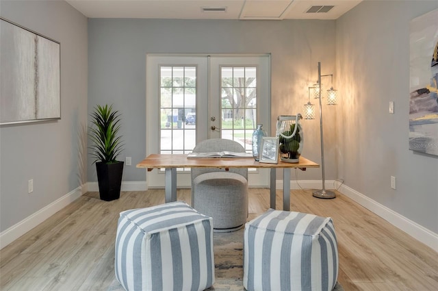 office space featuring light hardwood / wood-style flooring and french doors