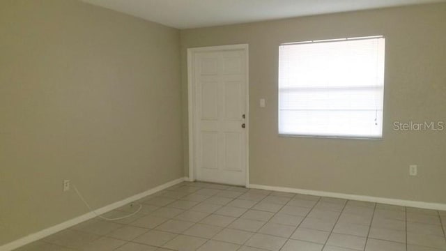 view of tiled spare room