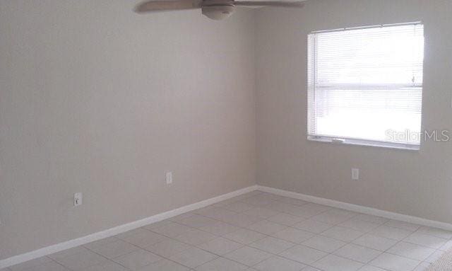 unfurnished room with ceiling fan