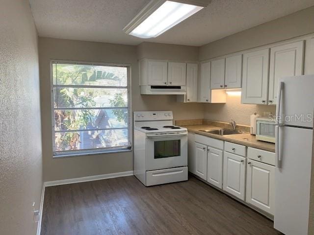 kitchen featuring white cabinetry, white appliances, sink, and a textured ceiling