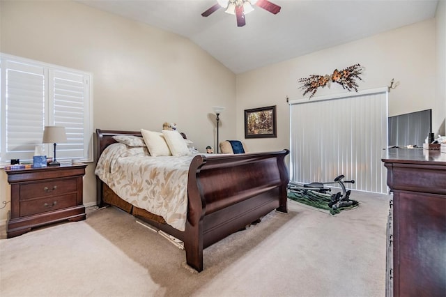 carpeted bedroom featuring ceiling fan and lofted ceiling