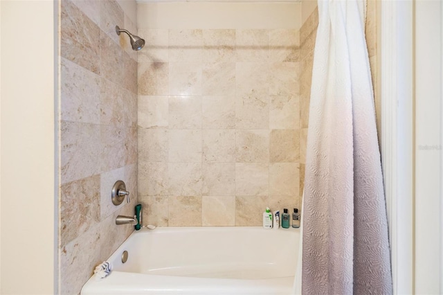 bathroom with shower / bath combo