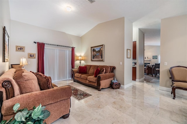 living room featuring vaulted ceiling