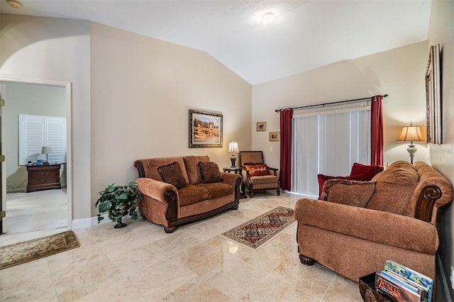 living room featuring lofted ceiling