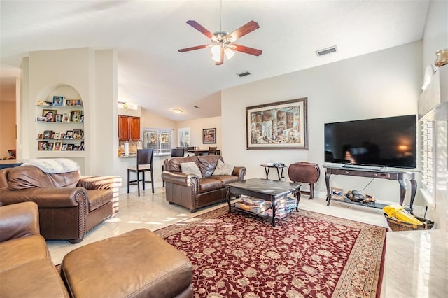 living room with ceiling fan, built in features, and vaulted ceiling