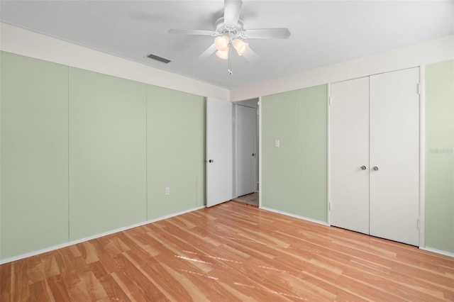 unfurnished bedroom with light hardwood / wood-style flooring and ceiling fan