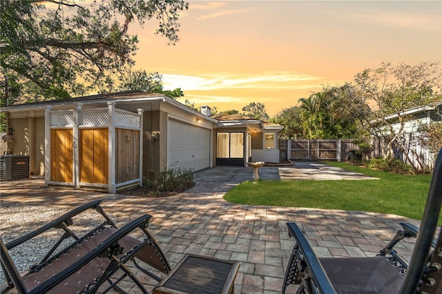 exterior space with a yard and central AC unit