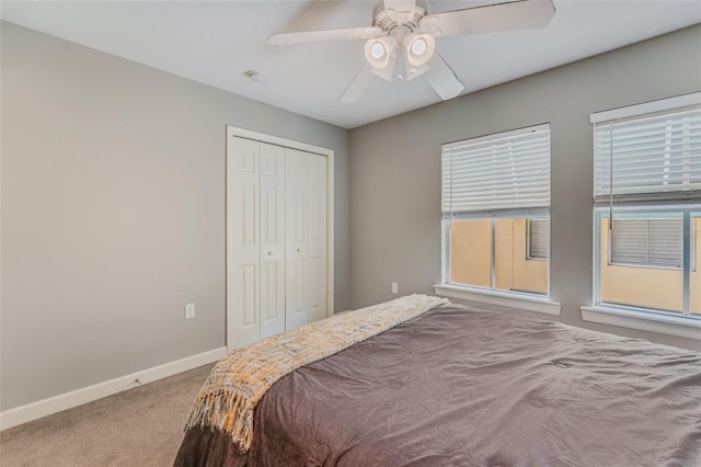 bedroom with carpet floors, a closet, and ceiling fan