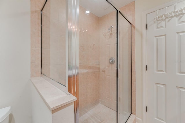 bathroom featuring an enclosed shower