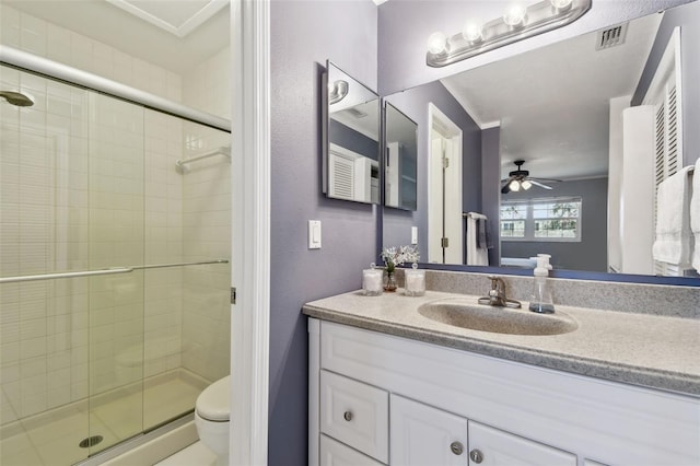 bathroom featuring ceiling fan, toilet, an enclosed shower, and vanity