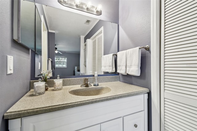 bathroom featuring vanity and ceiling fan