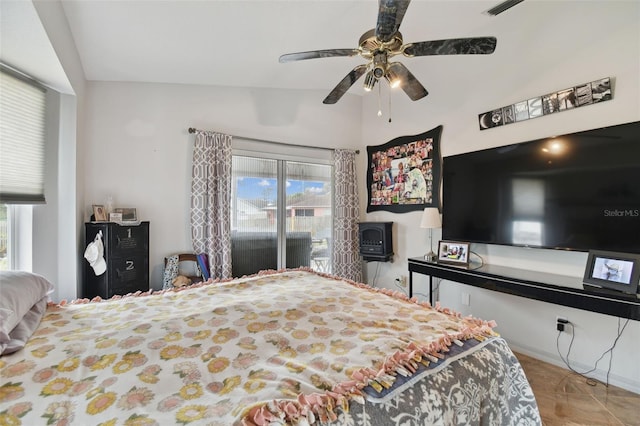 bedroom with ceiling fan, lofted ceiling, and access to outside