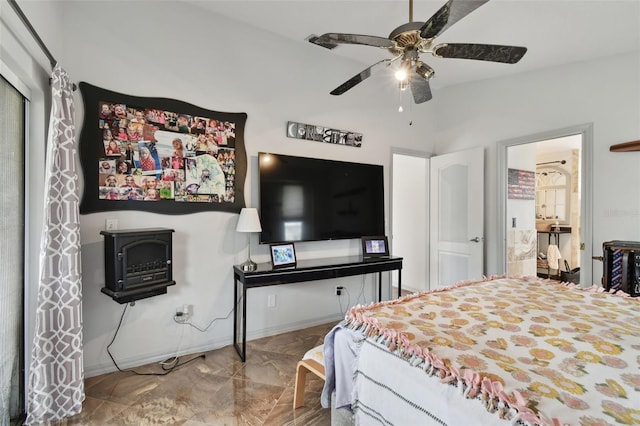 bedroom with ensuite bath, ceiling fan, and lofted ceiling