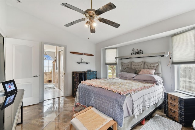 bedroom with connected bathroom, ceiling fan, and vaulted ceiling