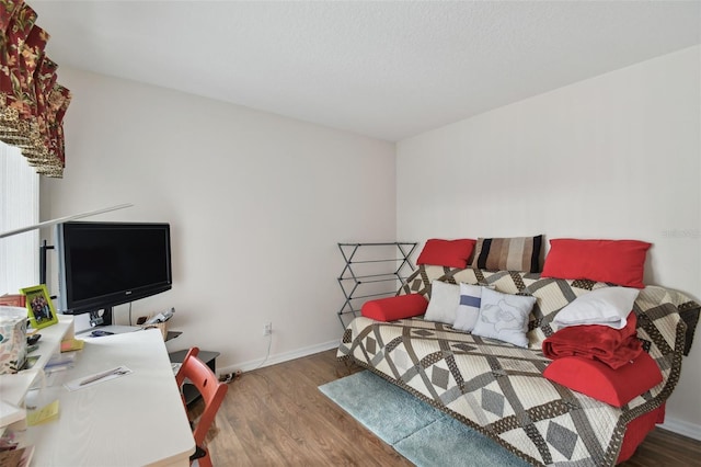 bedroom with dark wood-type flooring