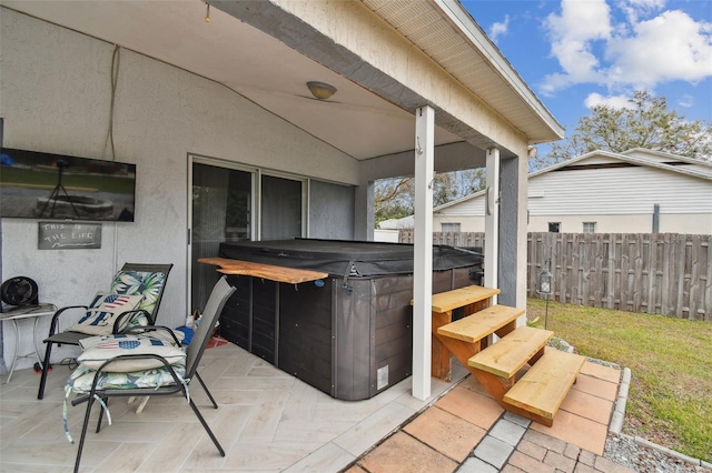 view of patio with a hot tub