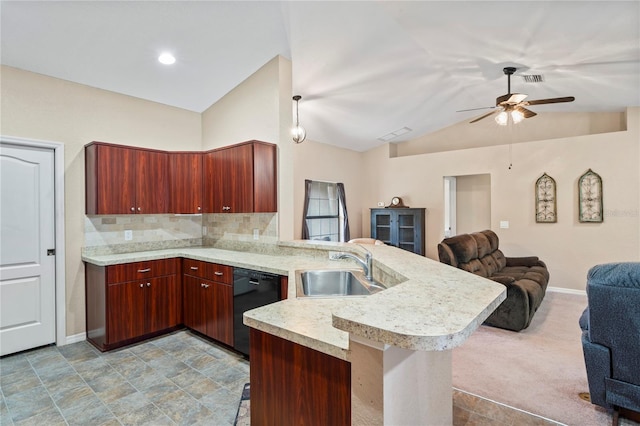 kitchen featuring kitchen peninsula, dishwasher, vaulted ceiling, a breakfast bar, and sink