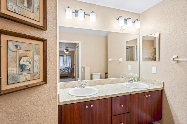 bathroom featuring toilet and vanity