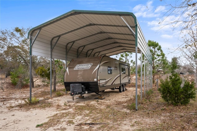 view of parking / parking lot featuring a carport