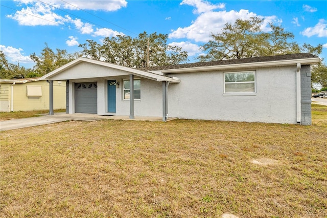 ranch-style home with a front yard and a garage