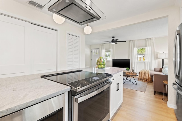 kitchen with stainless steel appliances, ceiling fan, white cabinetry, light hardwood / wood-style floors, and wine cooler