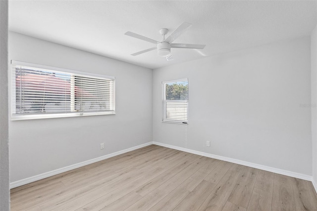 unfurnished room with ceiling fan and light hardwood / wood-style flooring