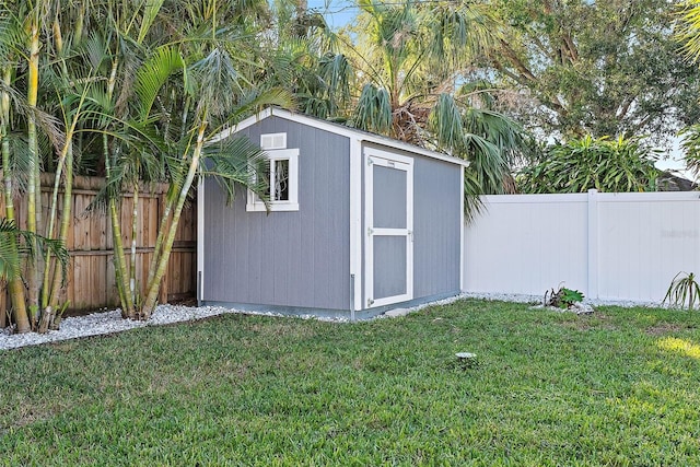 view of outdoor structure featuring a lawn