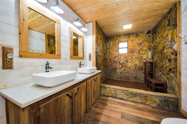 bathroom with hardwood / wood-style floors, vanity, and wooden ceiling