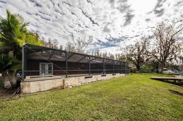 view of yard featuring glass enclosure