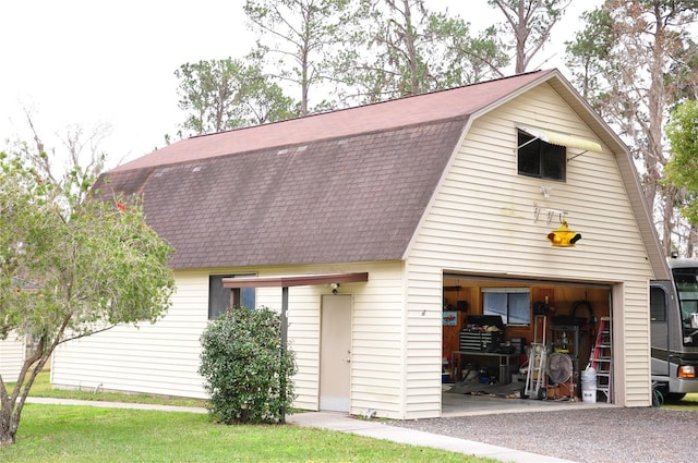 view of front of house with an outbuilding