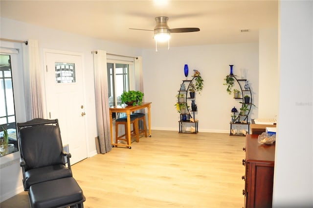 interior space featuring ceiling fan and light wood-type flooring