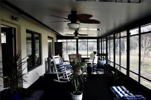 sunroom featuring ceiling fan