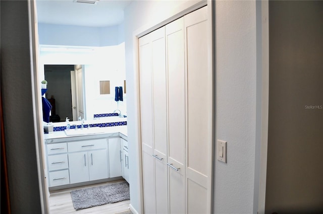 bathroom featuring vanity and wood-type flooring