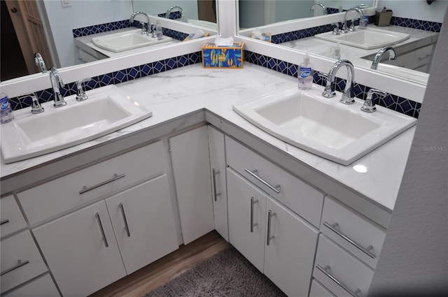 bathroom featuring vanity and hardwood / wood-style flooring