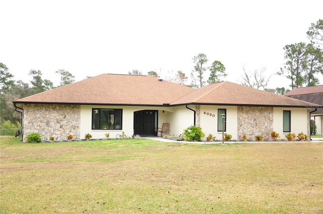 ranch-style house featuring a front lawn