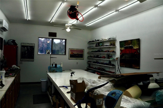 interior space with ceiling fan and a wall unit AC