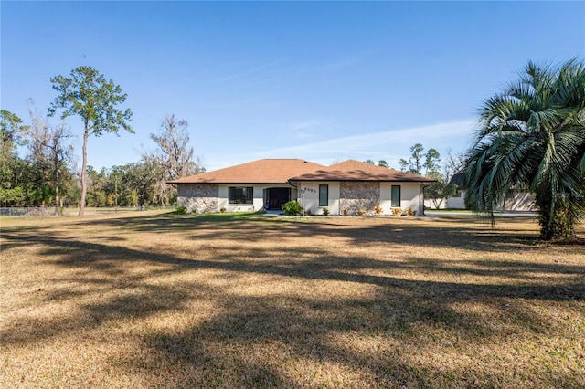 ranch-style home with a front yard