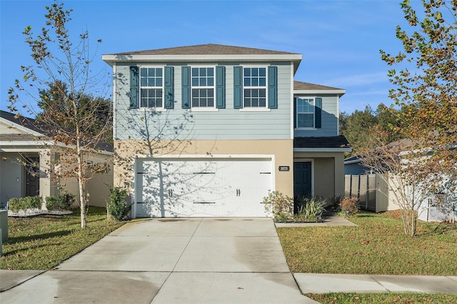 view of front facade featuring a front yard and a garage