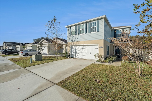 view of front of house featuring a garage and a front lawn