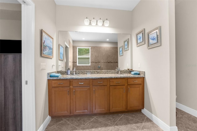 bathroom featuring vanity, tile patterned floors, and walk in shower