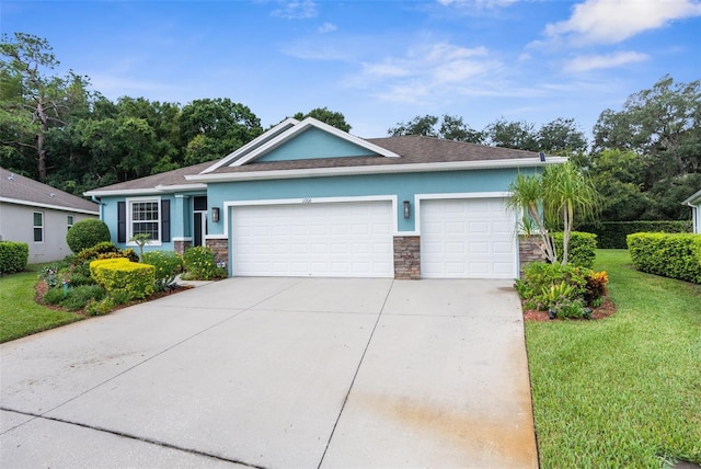 ranch-style home featuring a garage and a front lawn