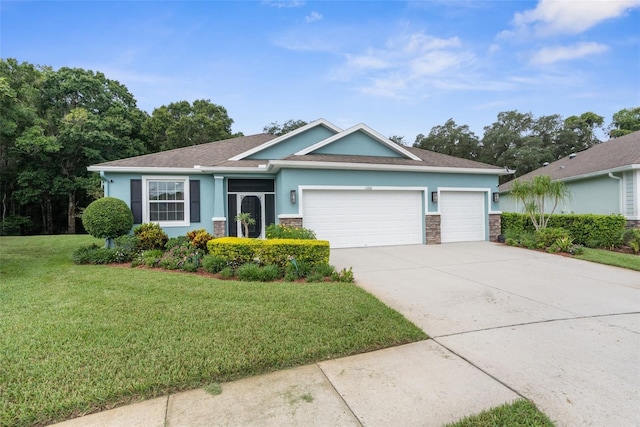 view of front of property with a front lawn and a garage