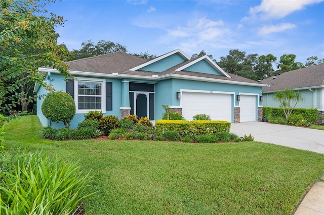 ranch-style house featuring a garage and a front lawn