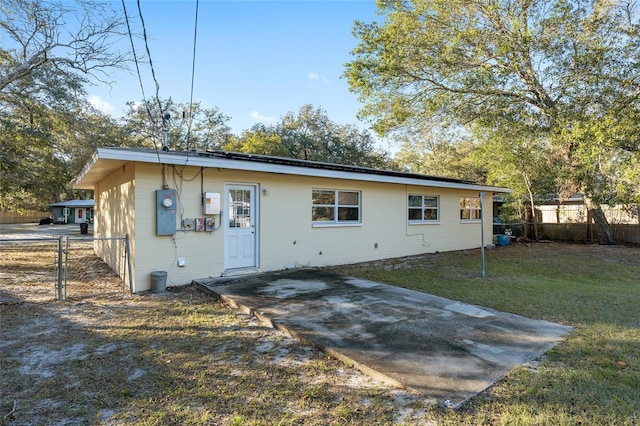 back of house with a yard