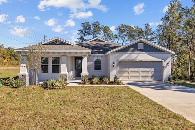 view of front of house with a front yard and a garage