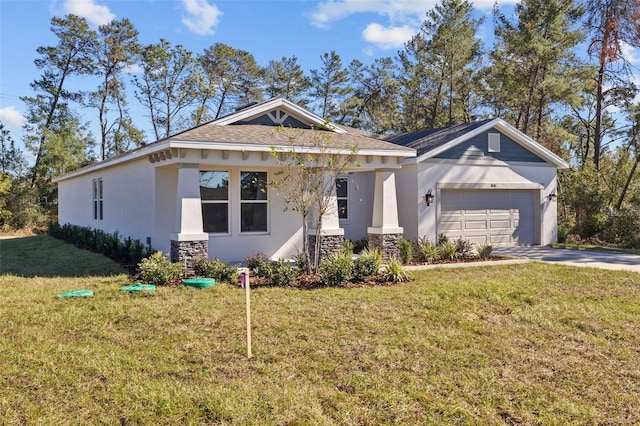 view of front of house featuring a garage and a front lawn