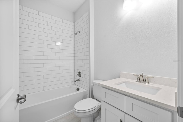 full bathroom featuring toilet, vanity, and tiled shower / bath combo